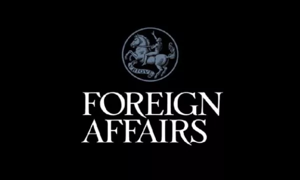 Logo of "Foreign Affairs," featuring a stylized emblem of a knight on horseback, set against a black background.